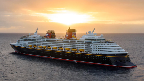 Disney cruise ship sailing in the sunset